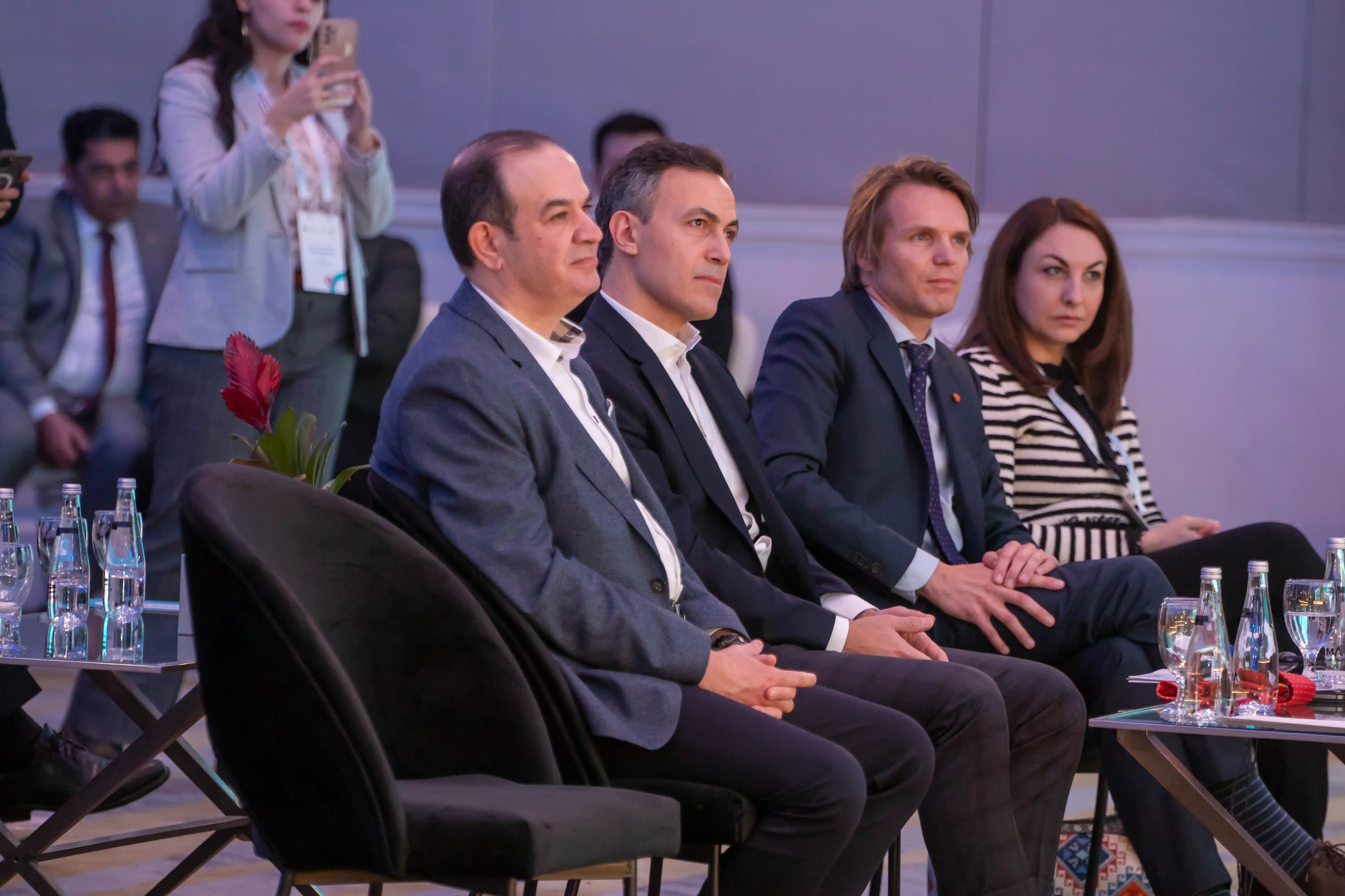Panel of distinguished guests observing the presentations